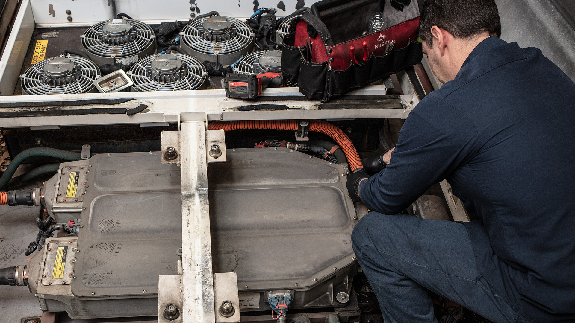 Technician working on an Allison DPIM