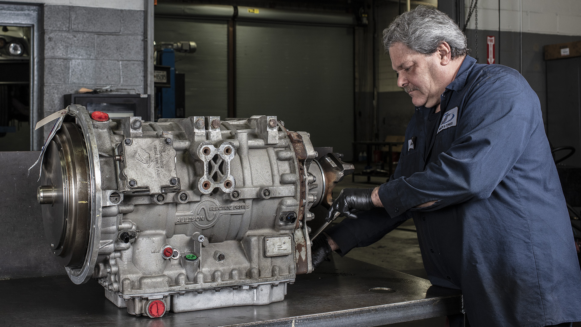 Technician working on an Allison H 40/50 EV Drive