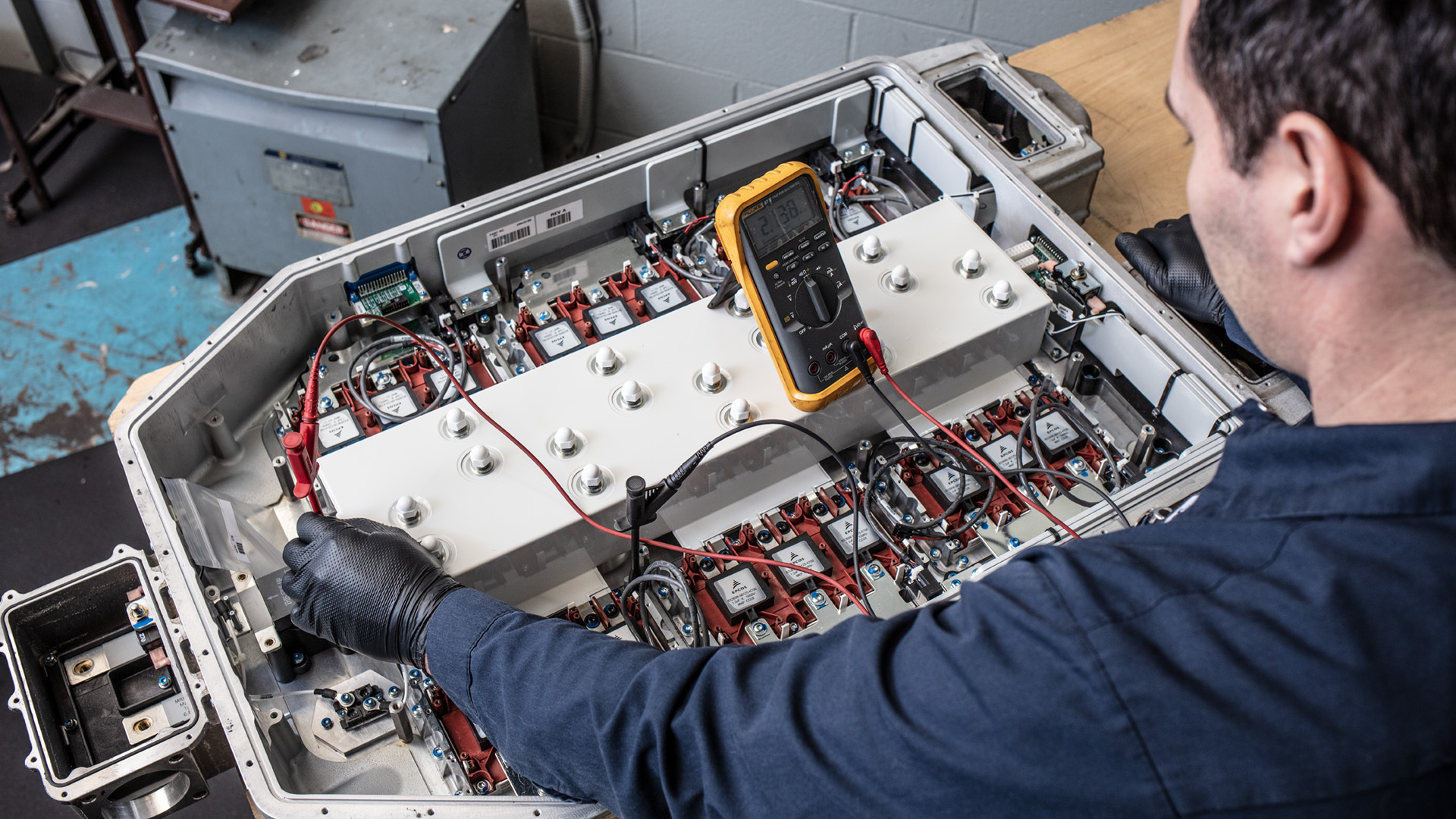 Technician working on an Allison DPIM