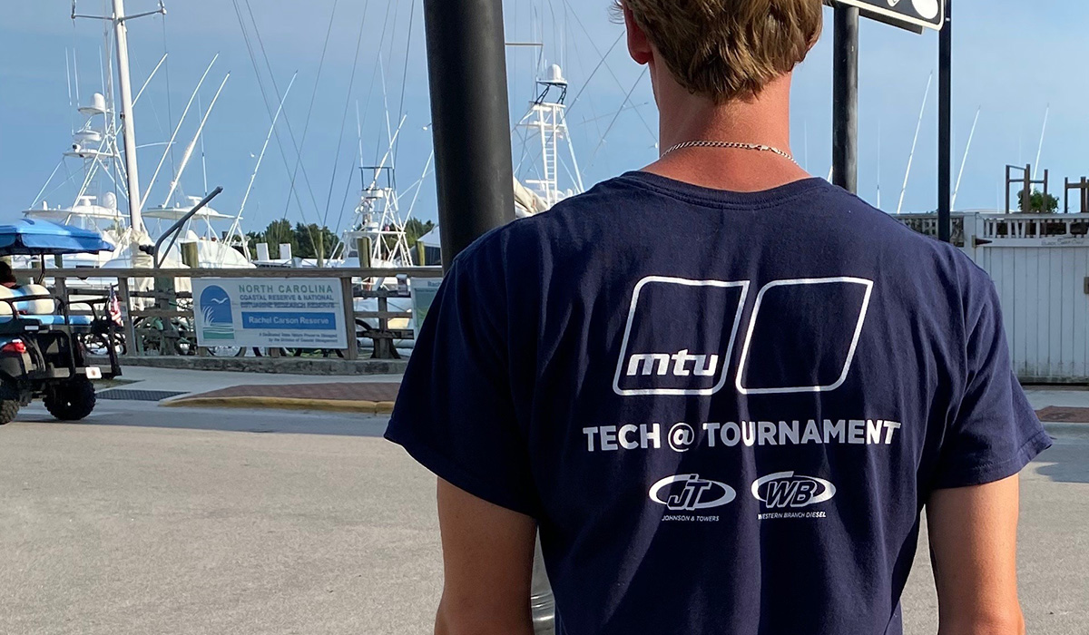 Technician wearing Tech @ Tournament t-shirt