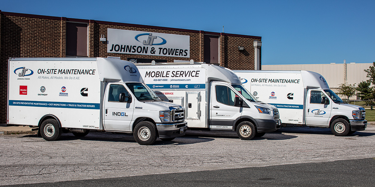Phot of Johnson & Towers service trucks
