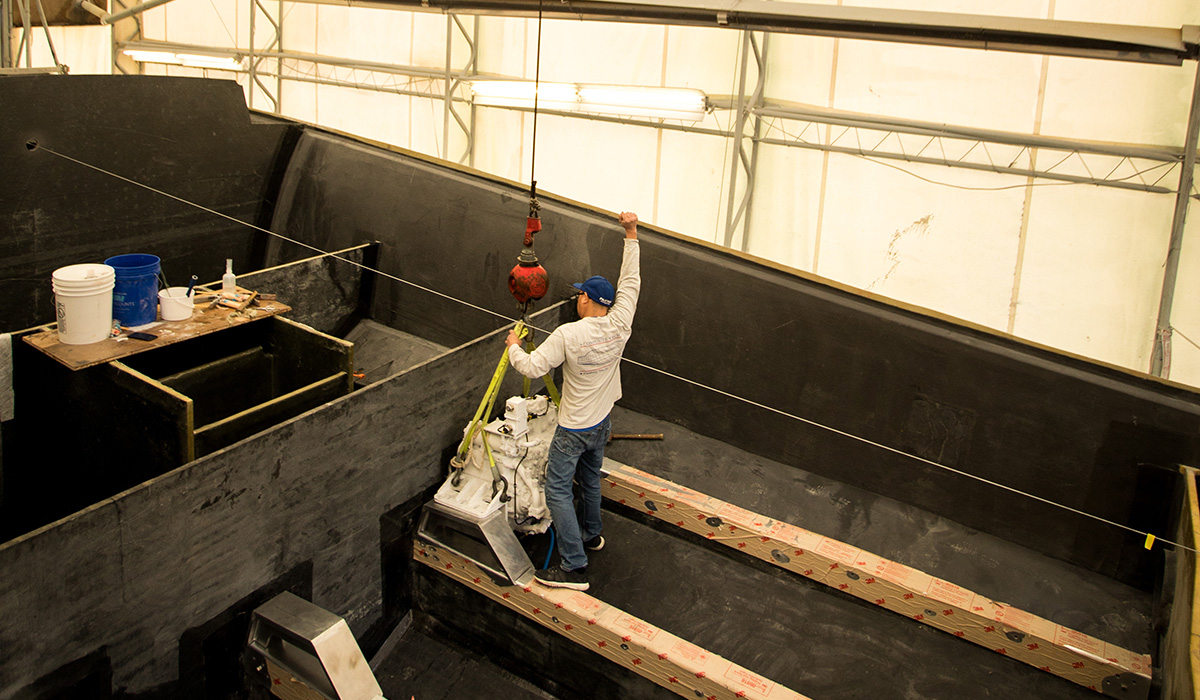 Photo of boat being prepared for engine installation