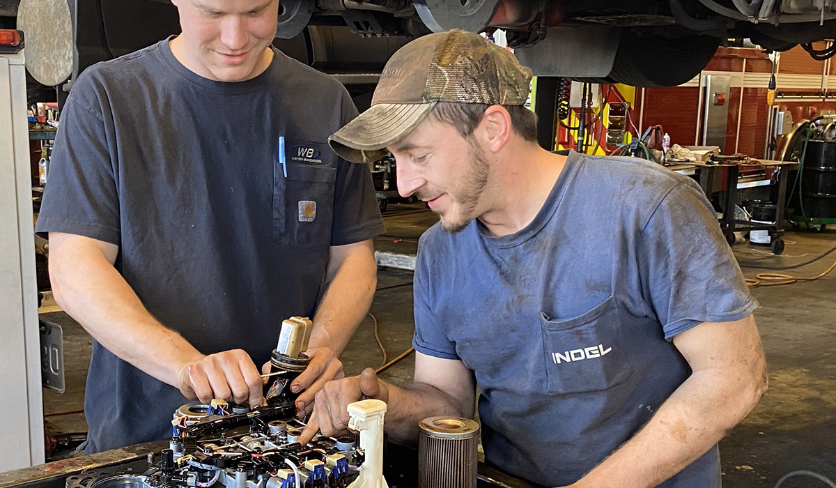 Photo of Technician Apprentice working with mentor.
